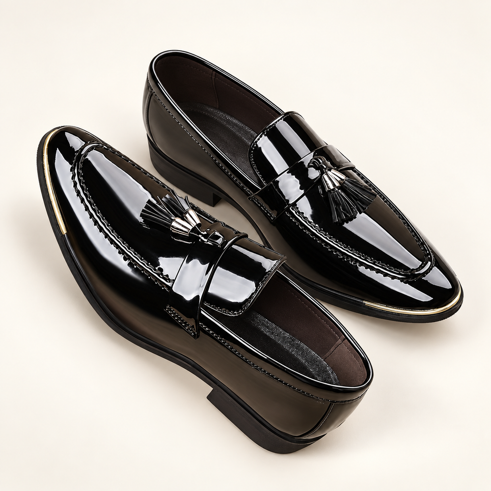Alistair black patent tassel loafers, pair in elevated three-quarter studio view