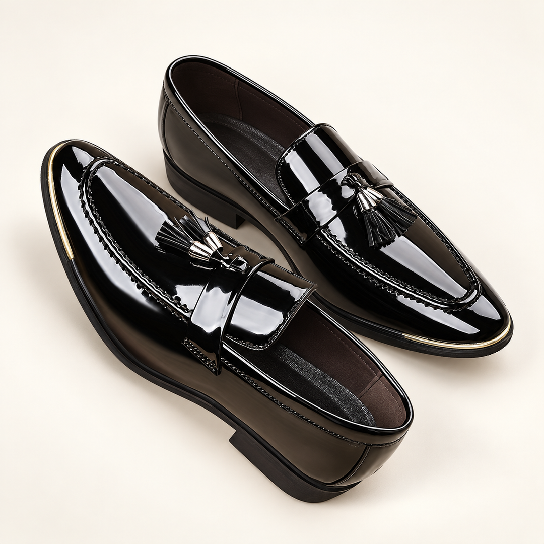 Alistair black patent tassel loafers, pair in elevated three-quarter studio view