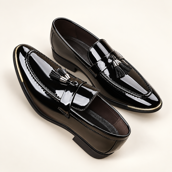 Alistair black patent tassel loafers, pair in elevated three-quarter studio view