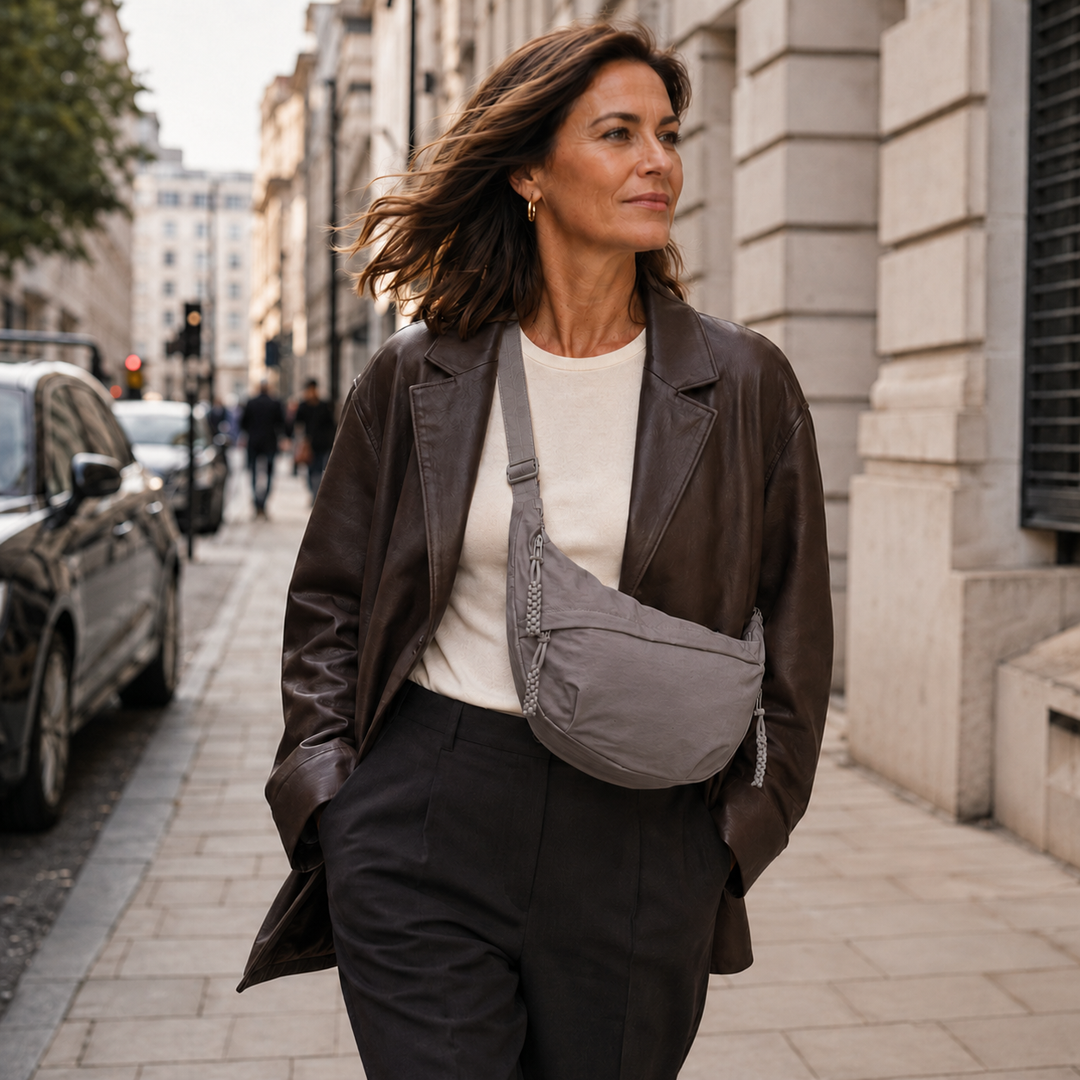 Clara grey shoulder bag worn crossbody in the city