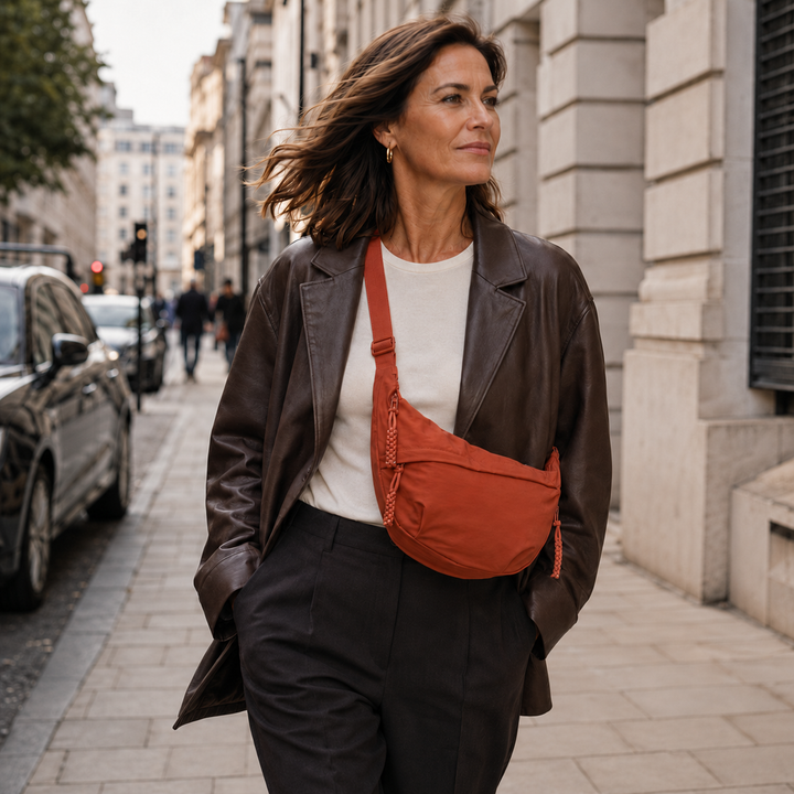 Georgia orange shoulder bag worn crossbody in the city