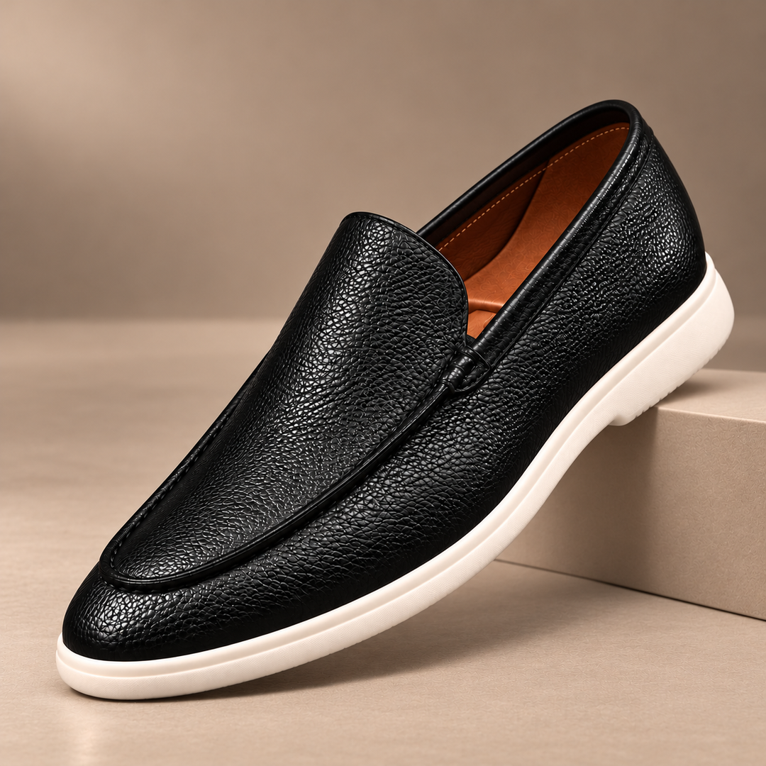Gianni Genuine Pebbled Leather Loafers in black, photographed in a warm taupe studio