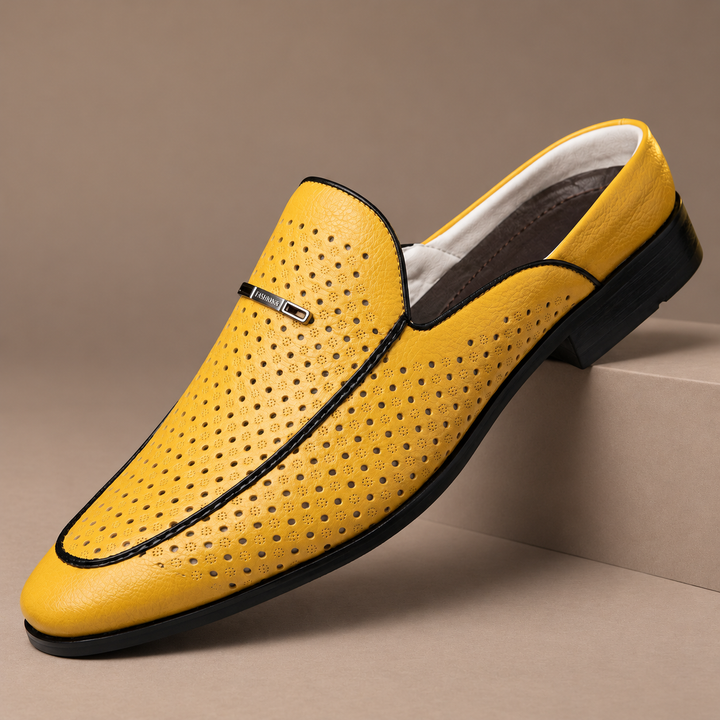 Castagnozzi Genuine Leather Perforated Loafers in yellow, photographed in a warm taupe studio