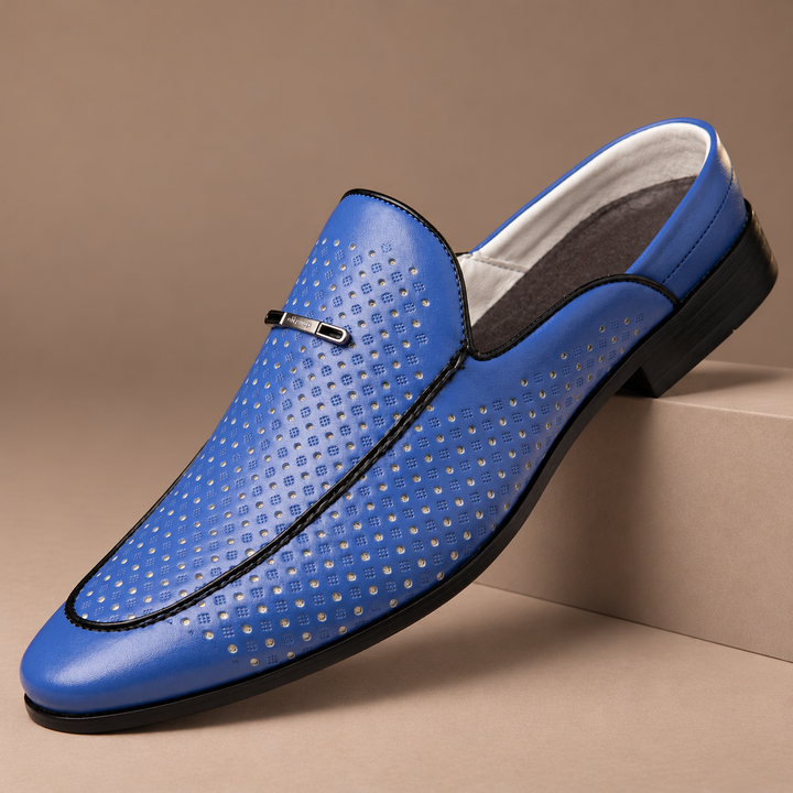 Castagnozzi Genuine Leather Perforated Loafers in blue, photographed in a warm taupe studio