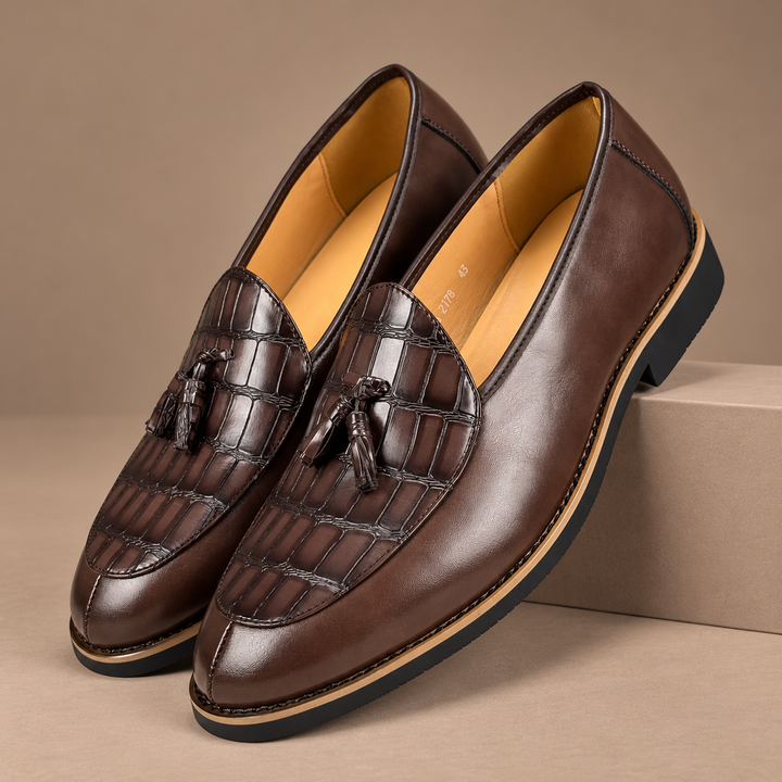 Genuine Leather Tassel Loafers in brown, photographed in a warm taupe studio
