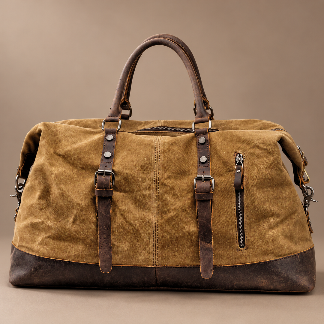 Heinrich Canvas Weekend Bag with Leather Trim in khaki, photographed in a warm taupe studio
