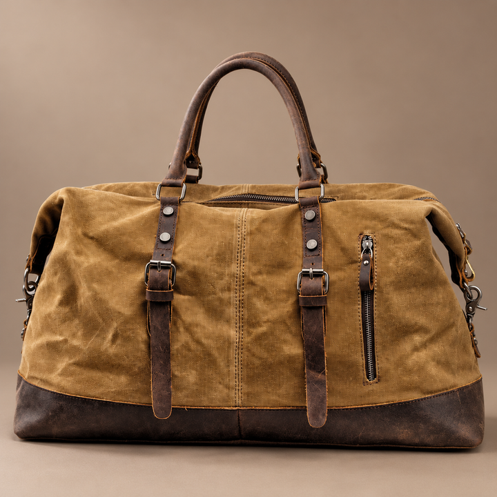 Heinrich Canvas Weekend Bag with Leather Trim in khaki, photographed in a warm taupe studio