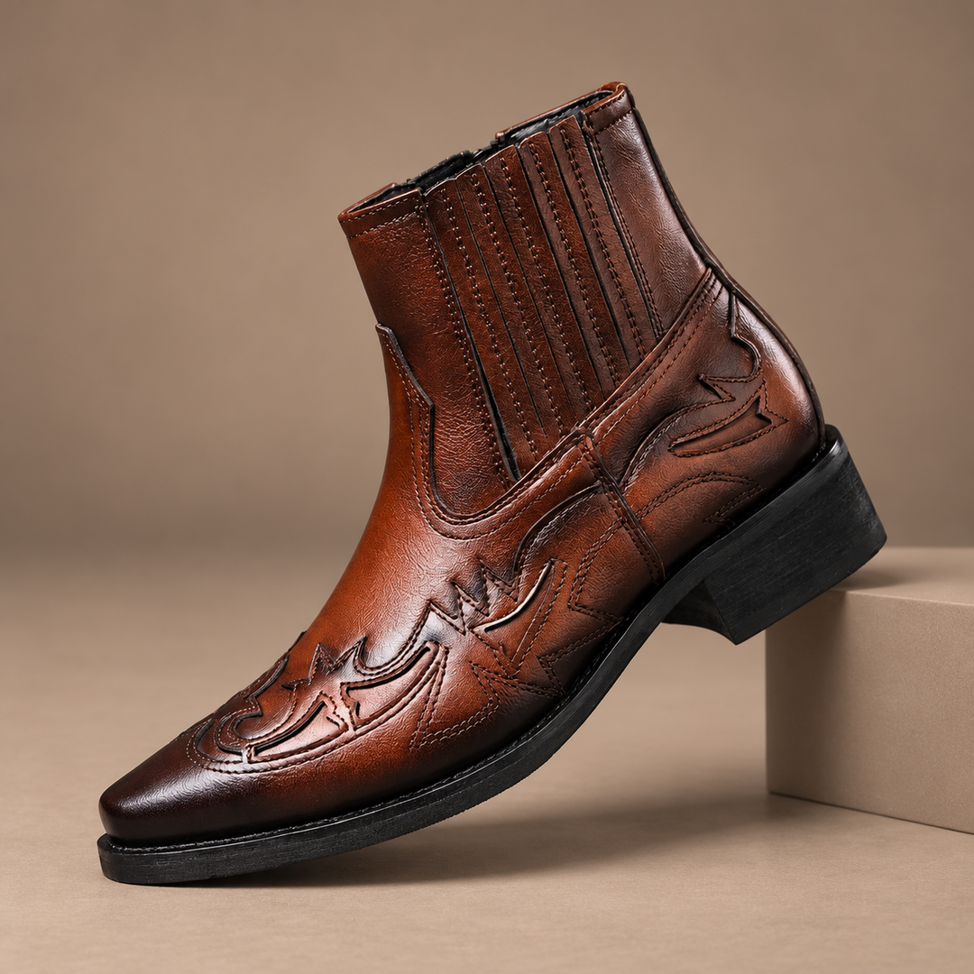 Nollan Genuine Leather Embossed Boots in dark brown, photographed in a warm taupe studio