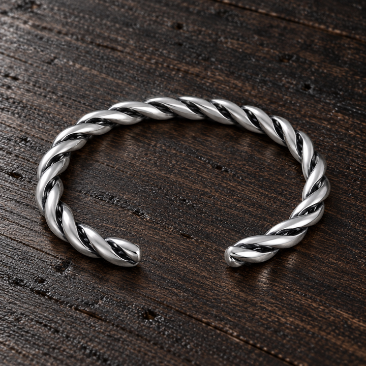 The Soho B-511S sterling silver twisted cuff, lying flat with its open ends aligned
