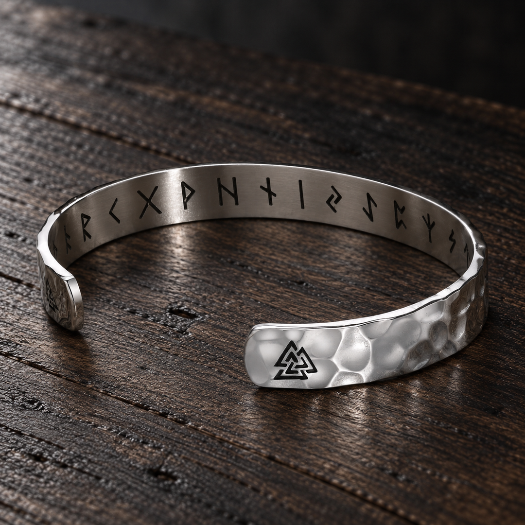 The Knightsbridge sterling silver hammered cuff with triangle details and inner runes on dark wood