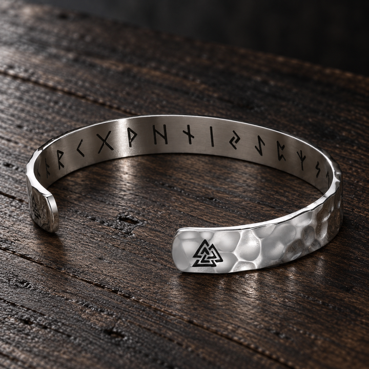 The Knightsbridge sterling silver hammered cuff with triangle details and inner runes on dark wood