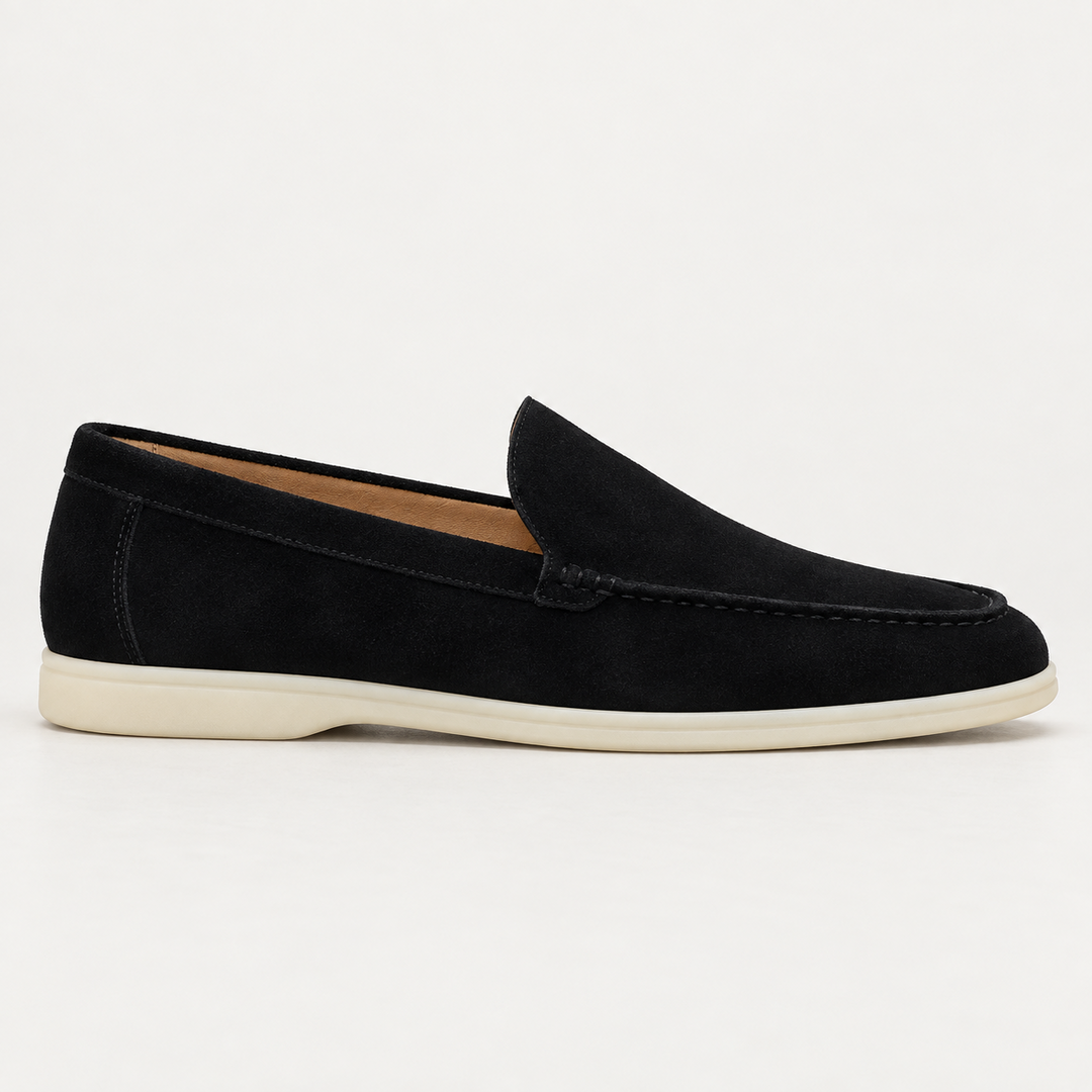 Side view of the Black Sloane loafer showing the stitching and cream sole