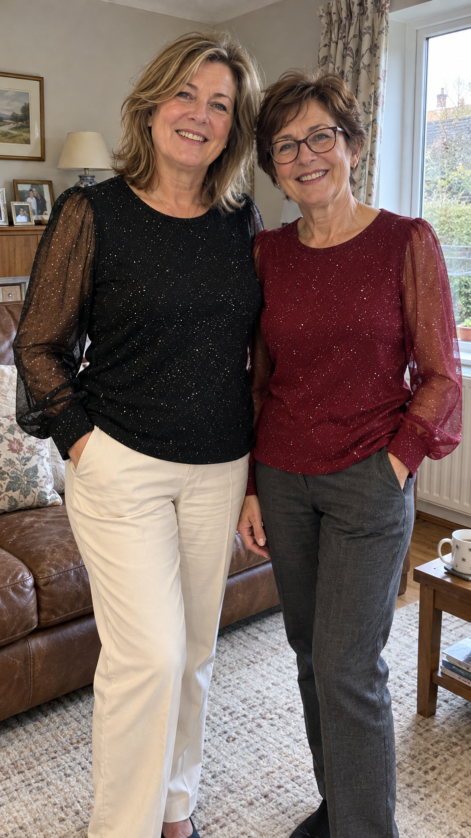 AI styling illustration: two women wearing black and burgundy Vivienne blouses in a living room