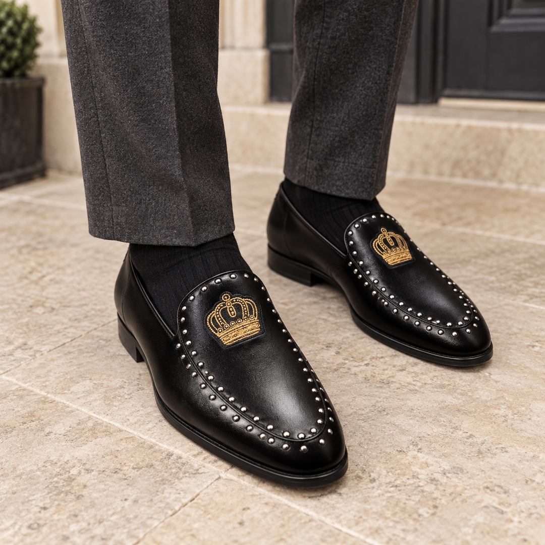 Black Winston crown loafers worn with charcoal tailored trousers